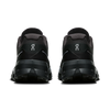 Black athletic shoes with a brand logo on a transparent background