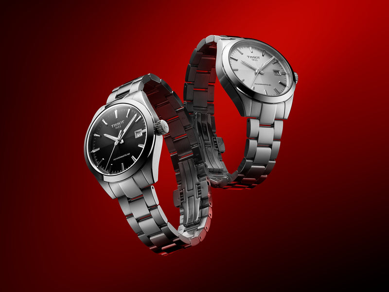 a silver and a gold designer watch