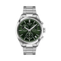 Close-up showcasing the Tissot PR100 chronograph watch with a green dial and stainless steel band. Features Tissot 1853