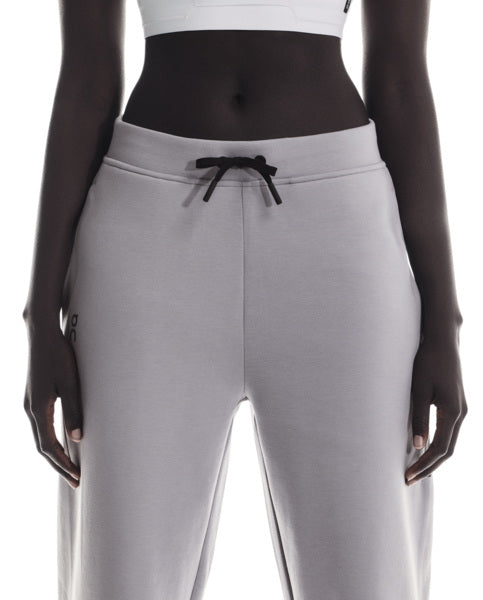 Lilac sweatpants with a black drawstring on a white background