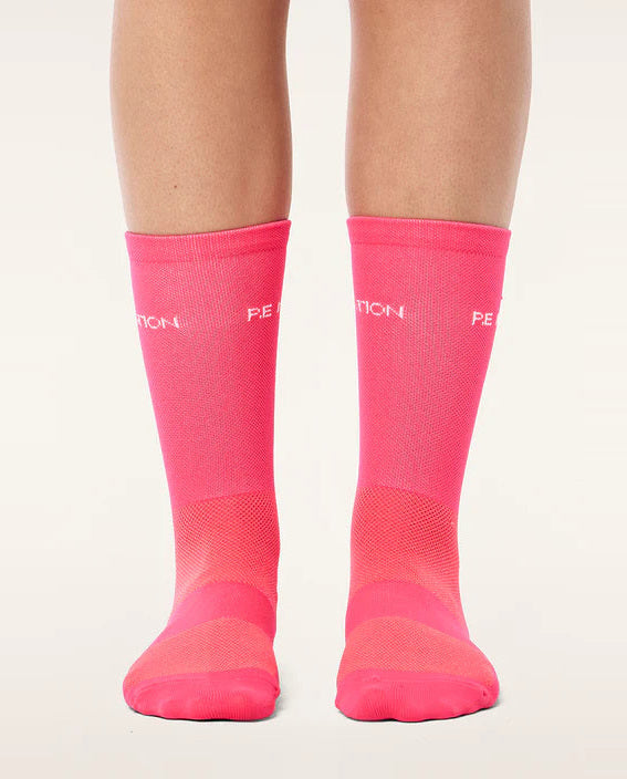 Pink socks with a brand logo on a white background