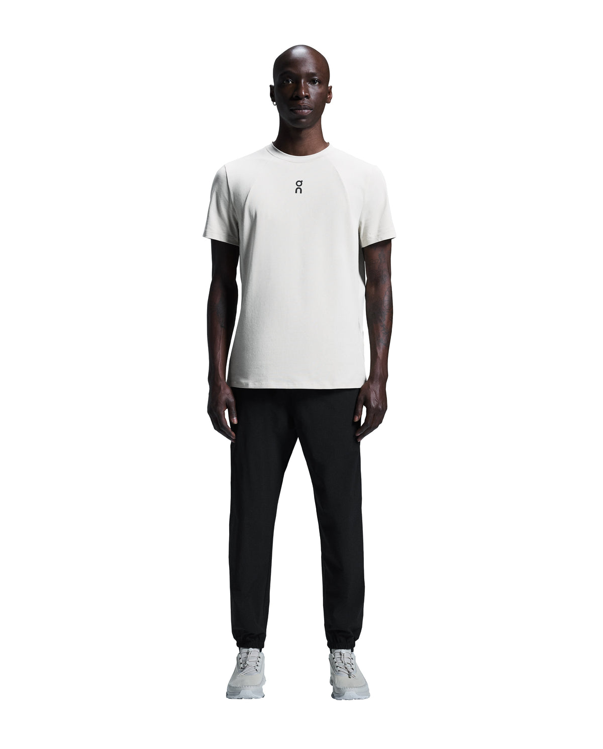 Men's On Running Black Focus Pants with on logo, styled with a matching on running t shirt and white on running trainers