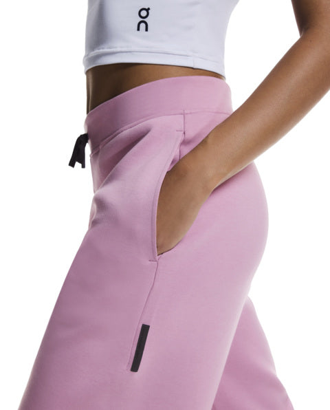 Pink pants with a white top on a white background