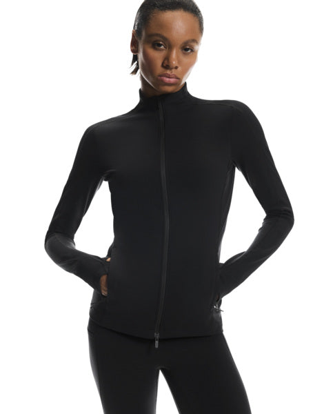 Person wearing a black zip-up athletic jacket on a white background