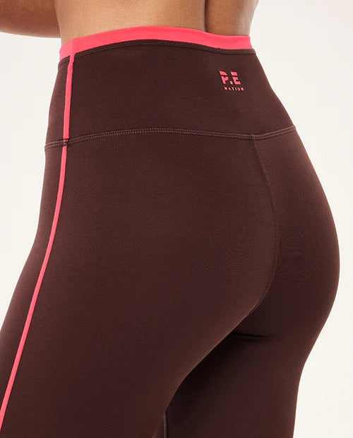 Brown leggings with pink accents on a white background