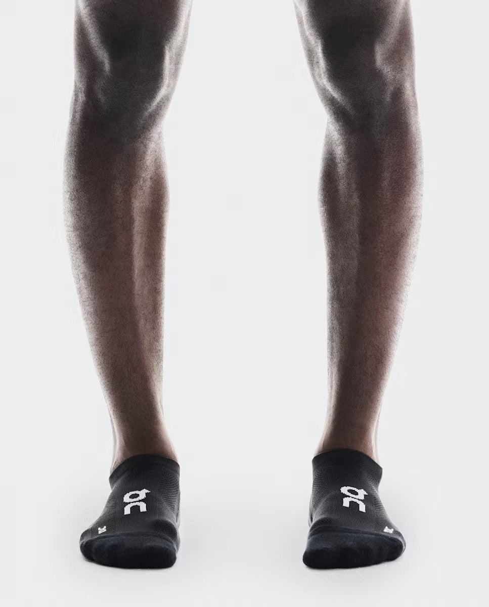 Unisex On Running Black Core Run Low 2-Pack Socks worn on model with on logo 
