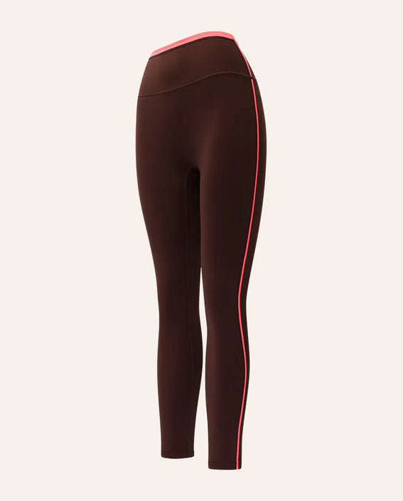 Brown leggings with a red stripe on a beige background