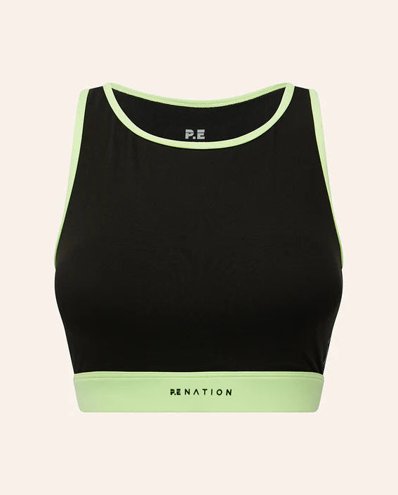 Grey sports bra with green trim on a light gray background