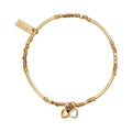 Gold bracelet with heart charms.
