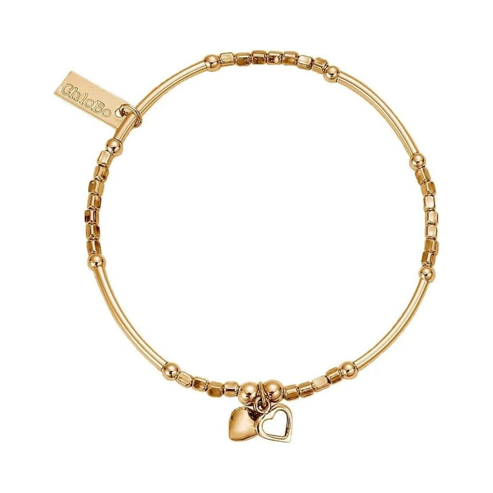 Gold bracelet with heart charms.
