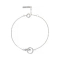 Silver chain bracelet by Olivia Burton, featuring linked circles and adjustable length. Minimalist jewelry.