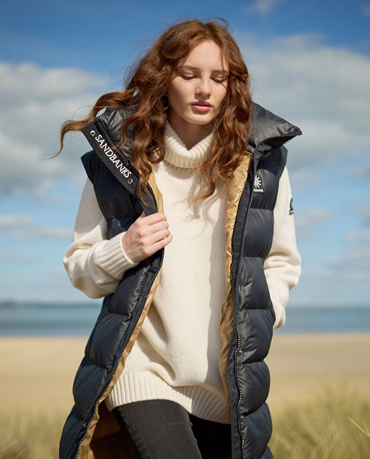 model wearing Sandbanks Black Long Shell Bay Hooded Gilet