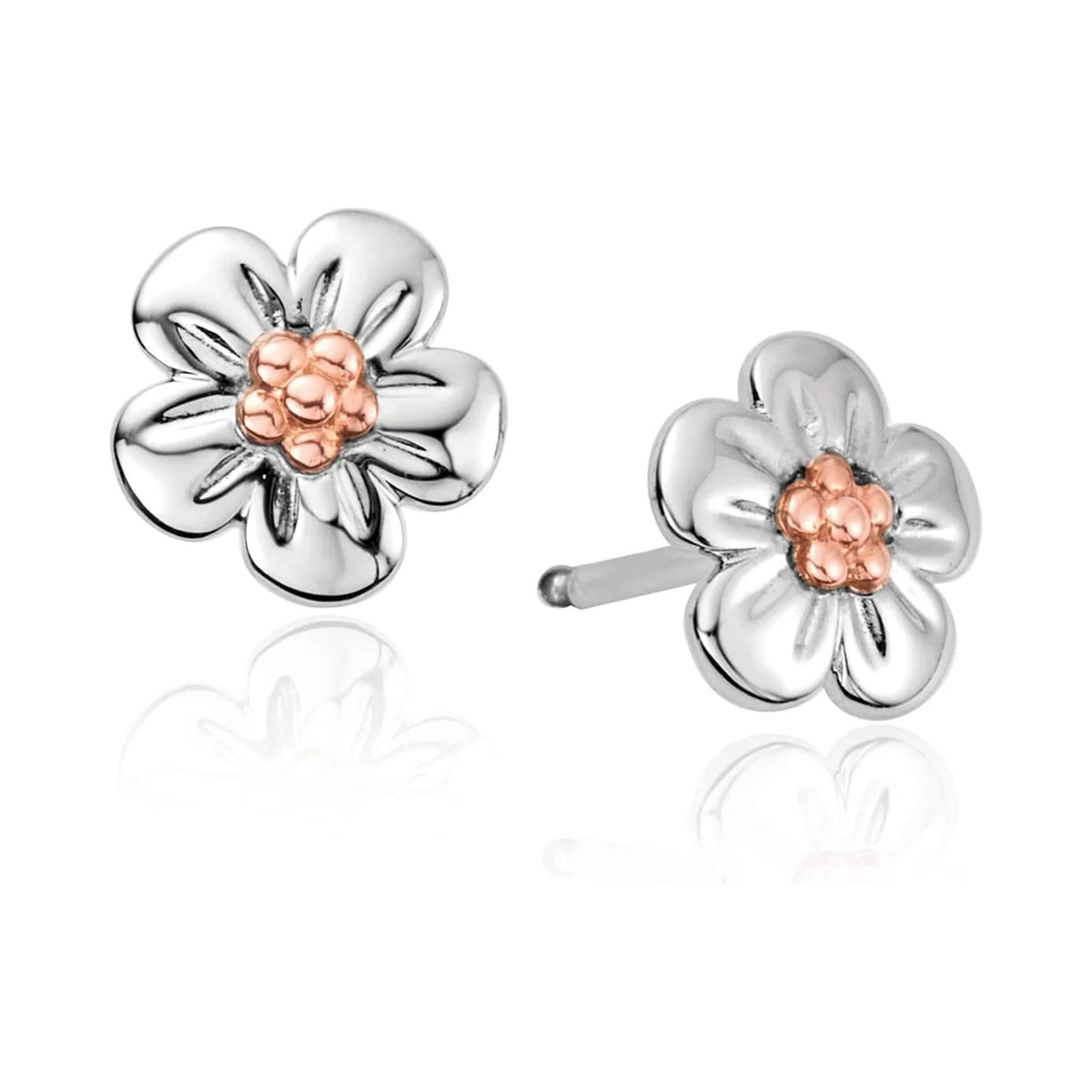 Clogau Forget Me Knot earrings. Sterling silver flower studs with rose gold center detail showcase nature-inspired design.