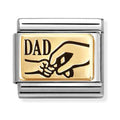 Silver and gold charm reading "Dad" with a graphic of a large hand holding a small hand.
