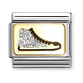 Metal charm with gold rectangle, featuring a sparkling ice skate.
