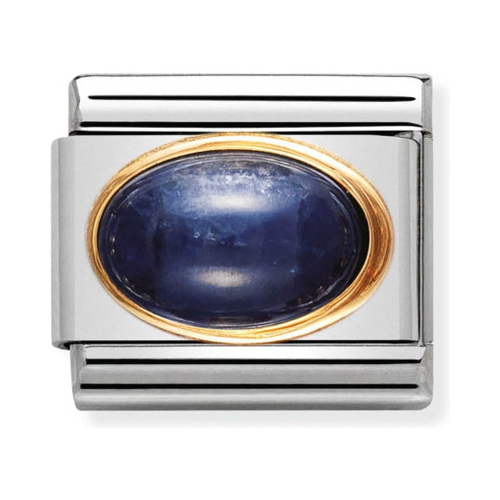 Silver charm with a blue stone and gold trim.