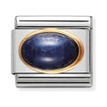 Silver charm with a blue stone and gold trim.