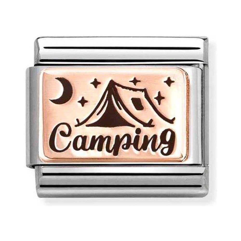 Close-up of a charm with a camping design.