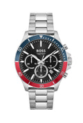 Close-up of BOSS Troper chronograph watch showcasing black dial, stainless steel band, & red/blue bezel.