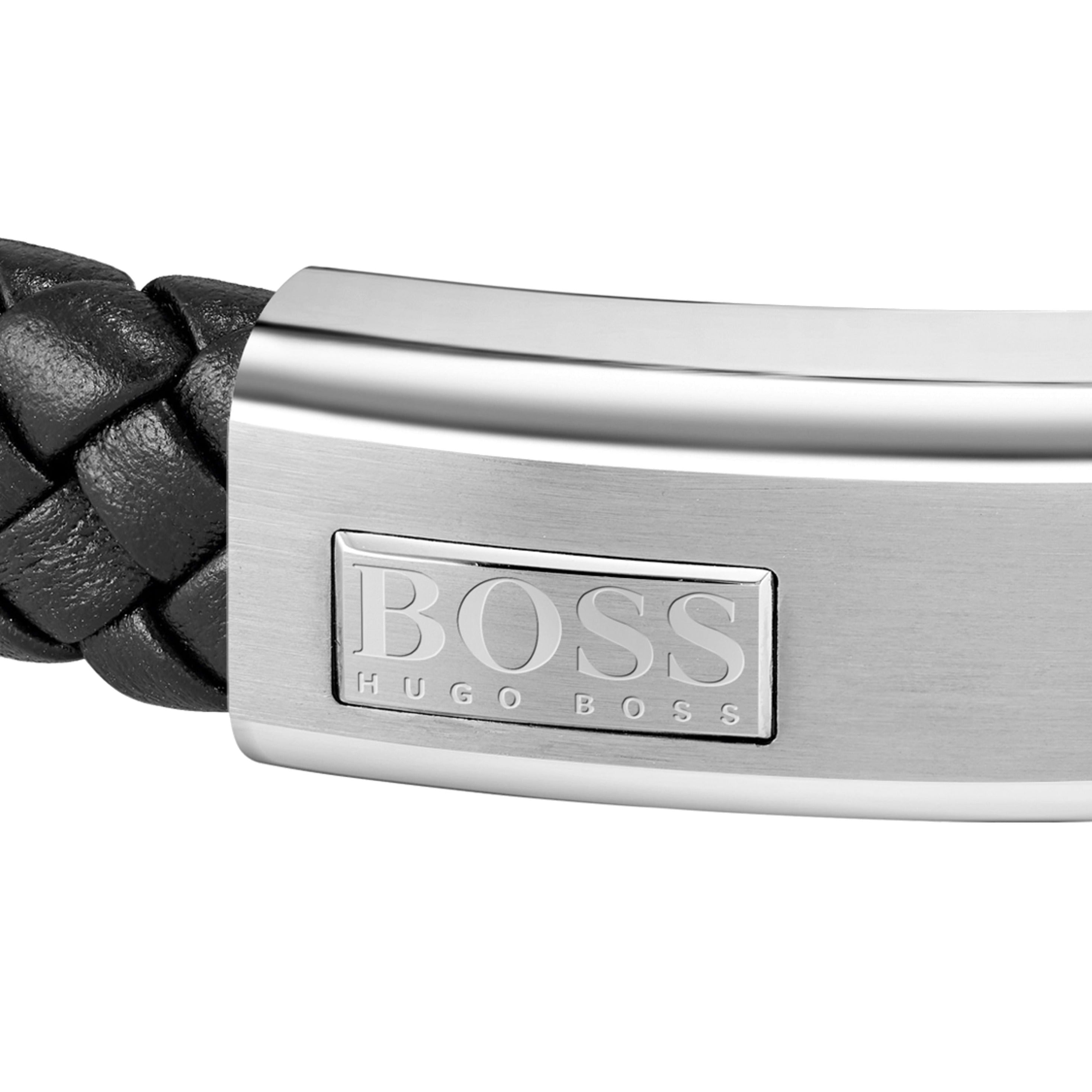 Close-up of the Boss Lander bracelet, showcasing the braided black leather and stainless steel clasp with Hugo Boss logo