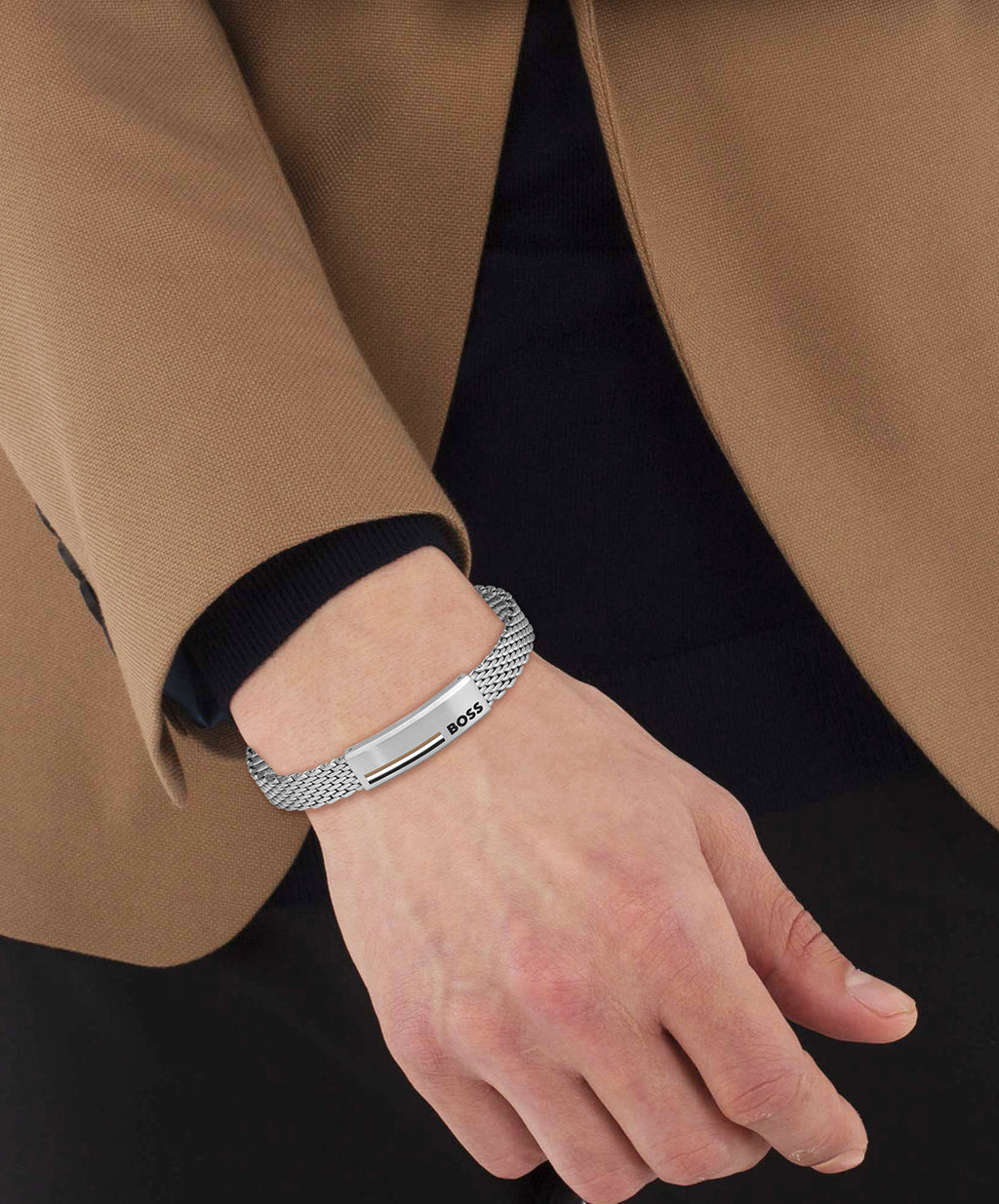 Man's wrist showcasing the BOSS Alen mesh bracelet in stainless steel. A brushed finish elevates this modern men's jewelry