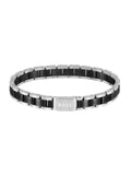 Polished BOSS bracelet featuring black and stainless steel links with engraved logo clasp detail. Premium menswear jewelry.