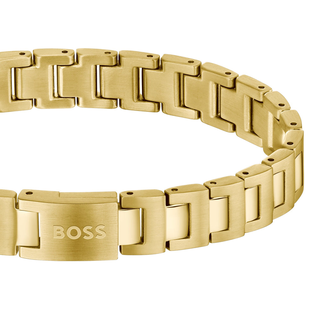 Gold-tone watch bracelet with Boss branding.