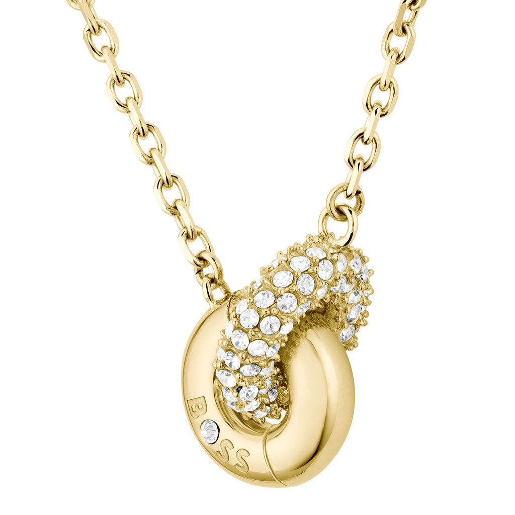 Gold chain necklace with crystal-studded pendant.
