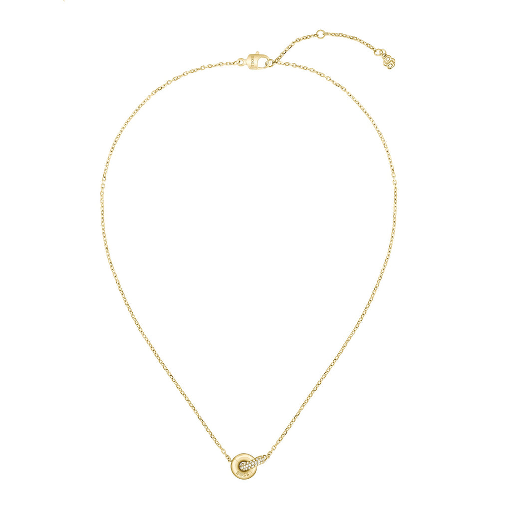Gold necklace with circle pendant.