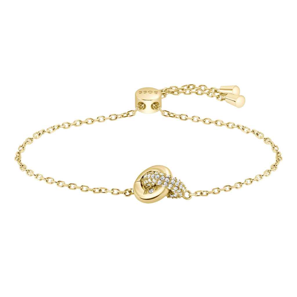 Gold chain bracelet with diamond-studded knot.