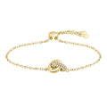 Gold chain bracelet with diamond-studded knot.