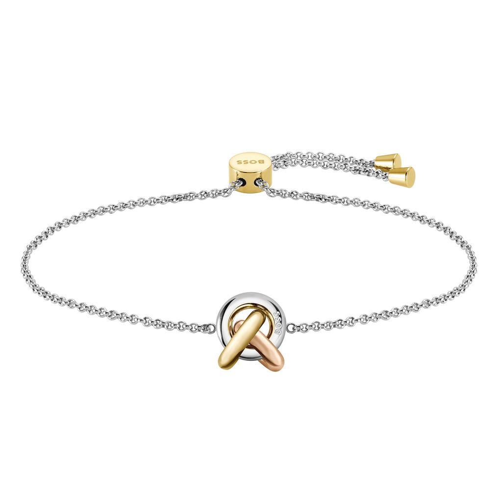Silver chain bracelet with a gold and copper-colored pendant, and "BOSS" on the gold chain clasp.
