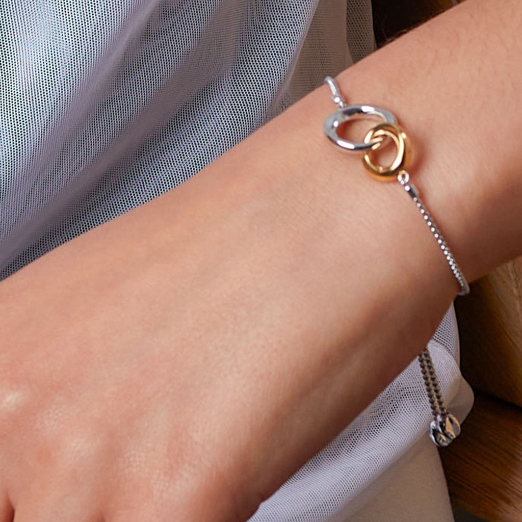 The Kit Heath Bevel Cirque Link Golden Toggle Bracelet in Silver Gold Plated, a gold-plated silver bracelet from Kit Heath, OD’s Jewellers in St Helens.