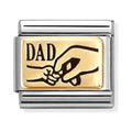 Silver and gold charm reading "Dad" with a graphic of a large hand holding a small hand.