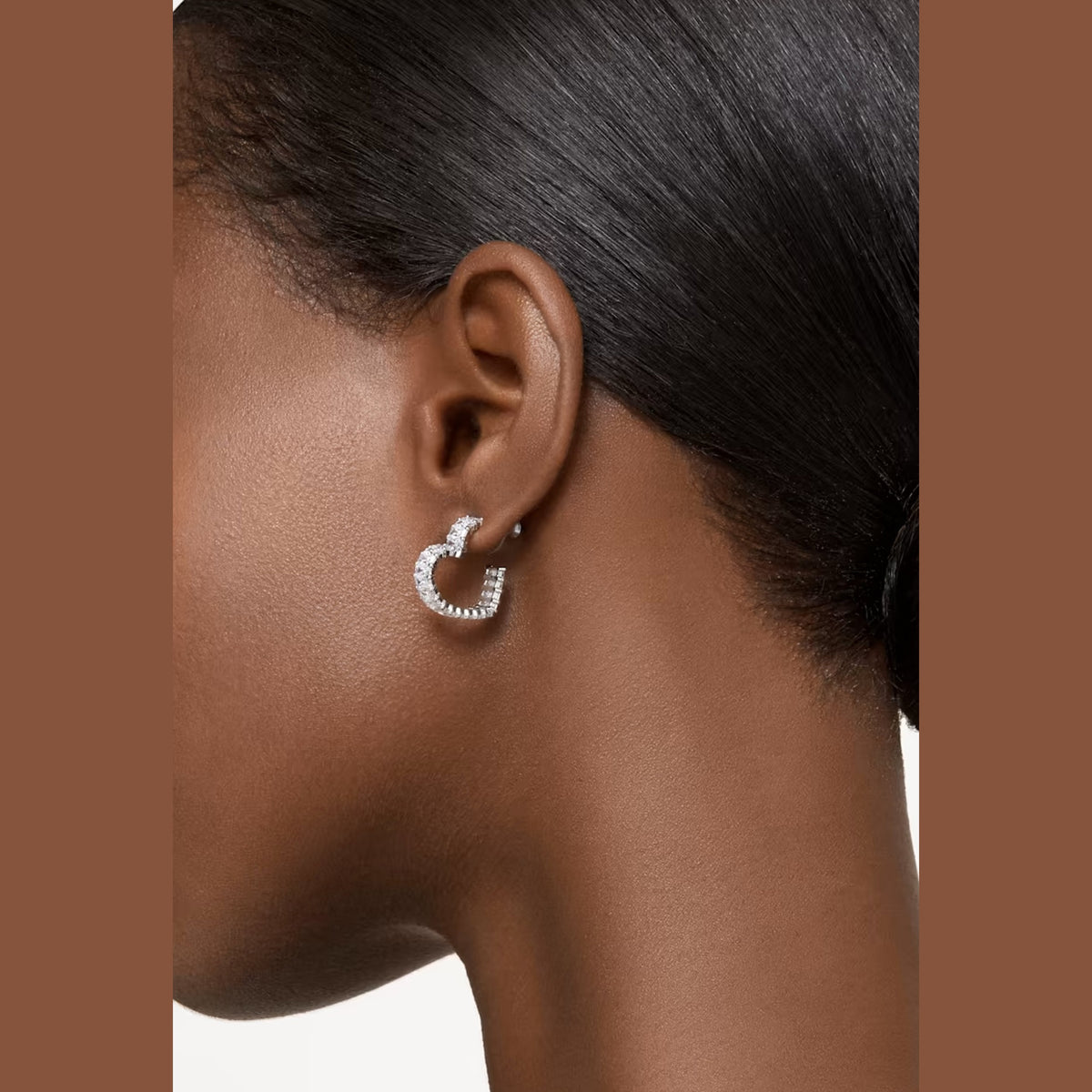 The Swarovski Matrix Small Heart Hoop Earrings, rhodium plated metal earrings from Swarovski, at OD’s Jewellers in St Helens.