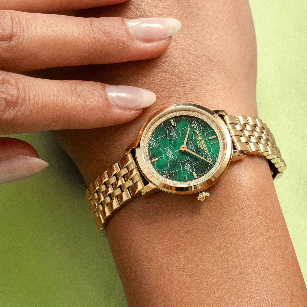 The Olivia Burton Honeycomb Ultra Forest Green Dial Bracelet Watch Gold Plated, a forest green dial bracelet watch from Olivia Burton, available at OD’s Jewellers in St Helens