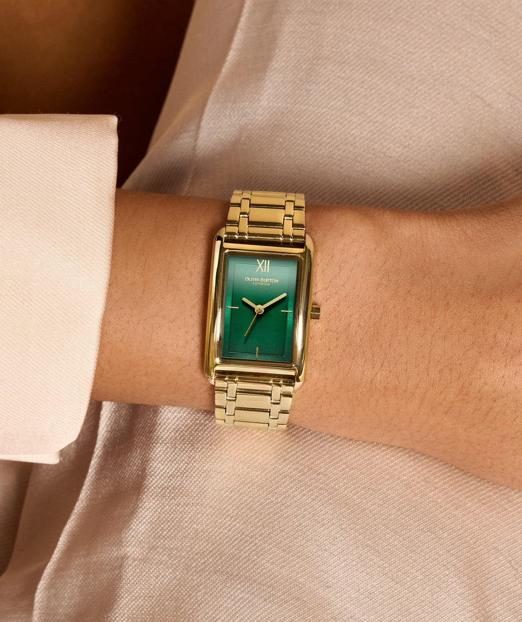 The Olivia Burton Grove Green Tank Dial Bracelet Watch Gold Plated, a green gold plated watch from Olivia Burton, available at OD’s Jewellers in St Helens