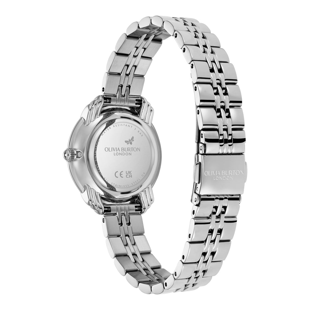 Close-up view of a silver Olivia Burton London wristwatch with a butterfly logo.