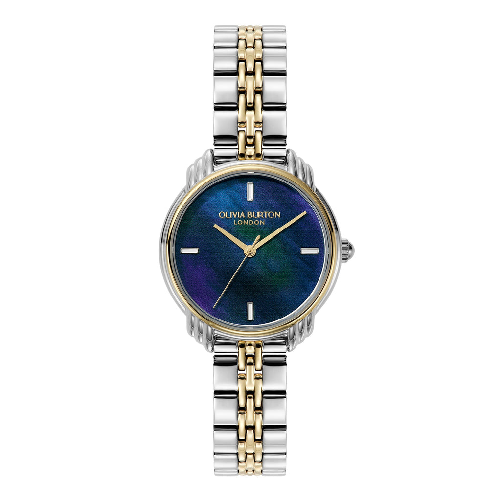 Close-up of a silver and gold Olivia Burton wristwatch with a blue and purple marbled face.