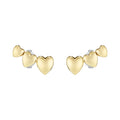 Earrings with three gold heart shapes.