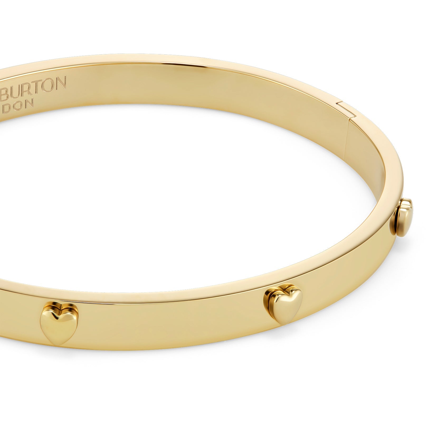 Gold bracelet with heart charms.
