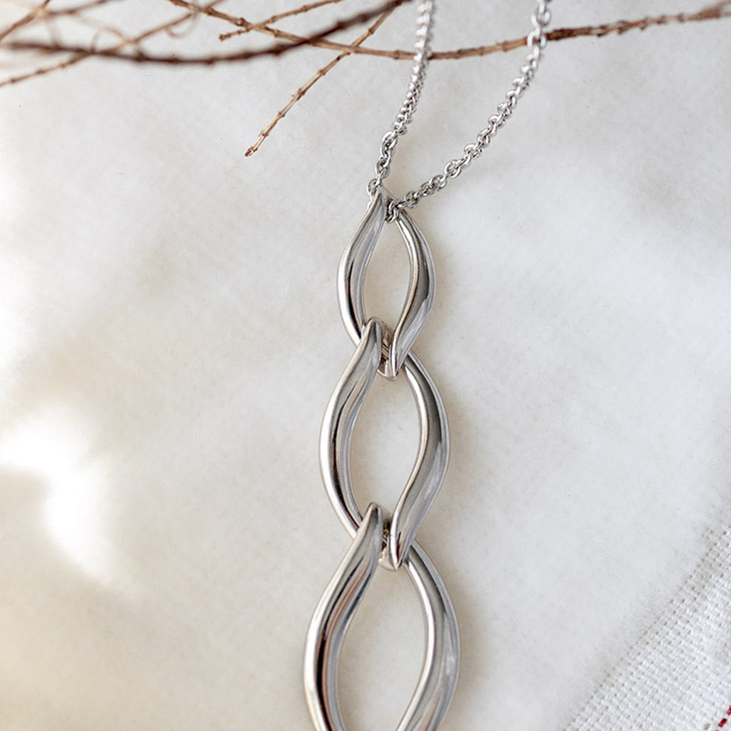 The Kit Heath Entwine Twine Trio Link Necklace, a silver necklace from Kit Heath, available at OD’s Jewellers in St Helens.