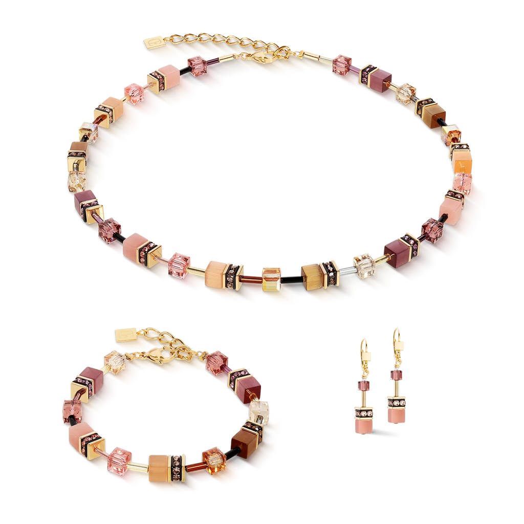 Beaded necklace, bracelet, and earrings with gold accents.
