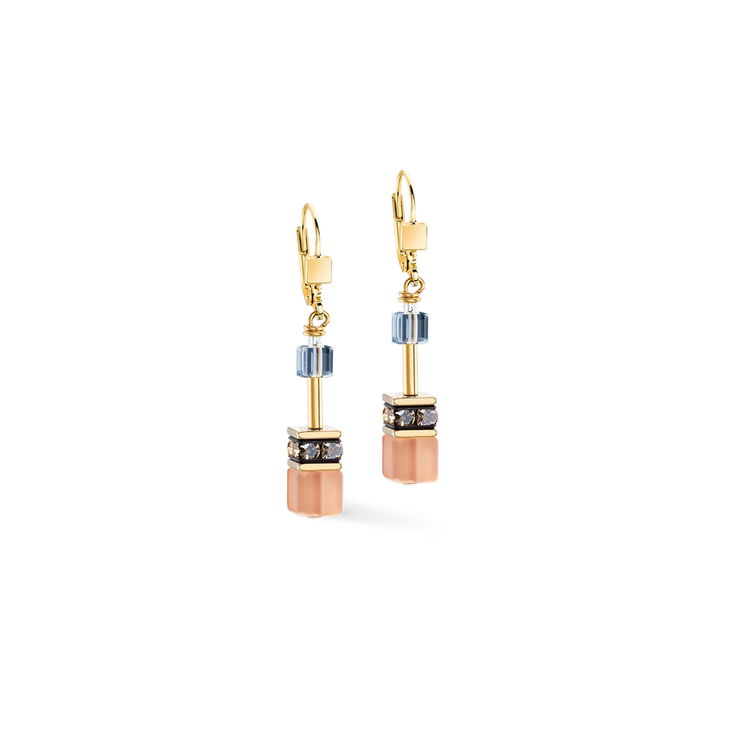 Dangling earrings with light blue crystals, square stone details, and gold metal.