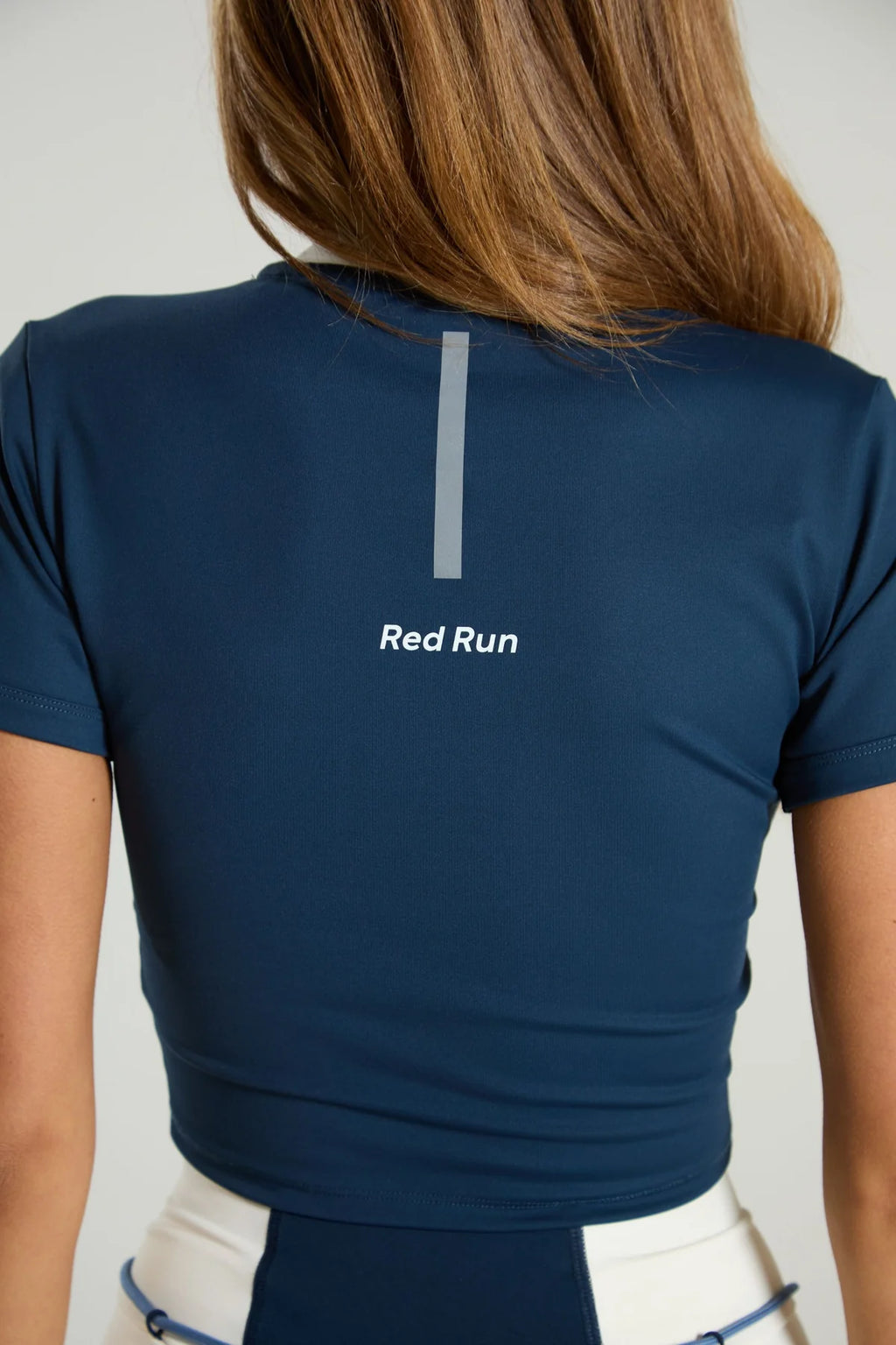 Women's Red Run Activewear Baby Tee in Blue — view 3
