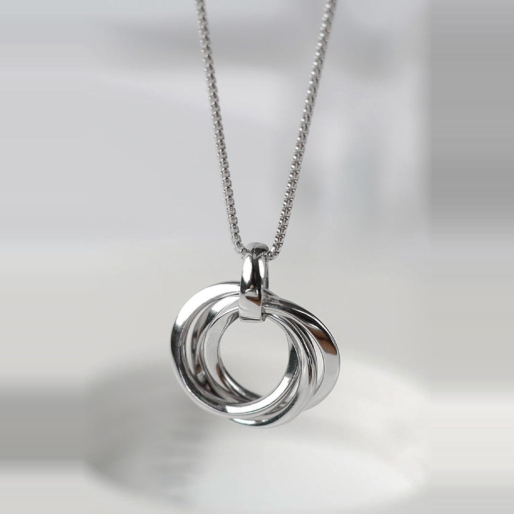 Silver Kit Heath Trilogy Necklace showcasing the interconnected rings pendant with rhodium plating on a delicate chain.