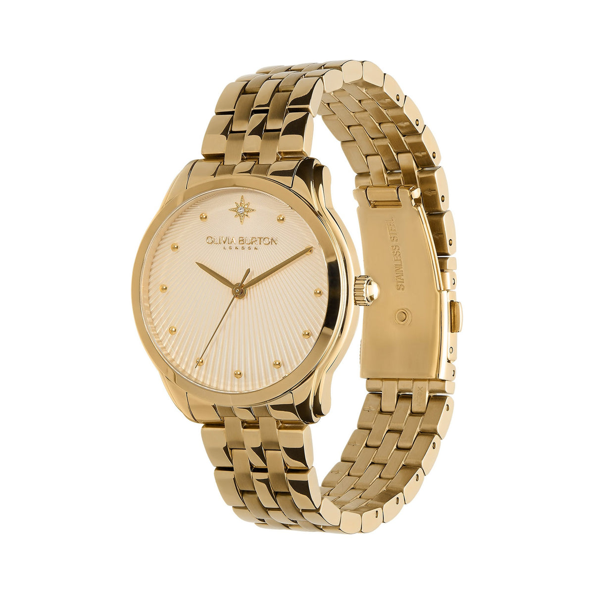 Close-up of the Olivia Burton Starlight gold-plated bracelet watch, showcasing the textured dial and woven-style band.