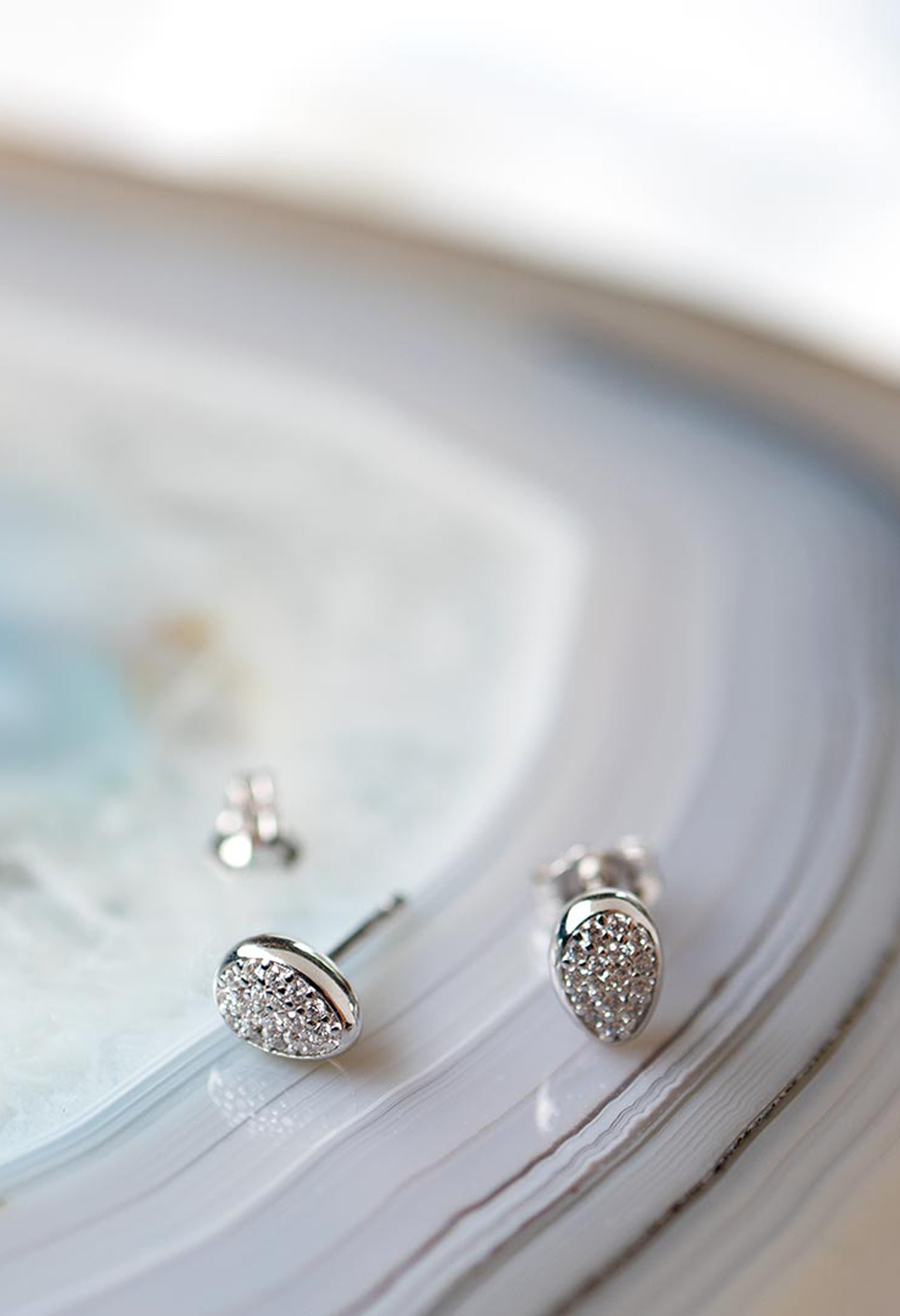 Silver stud earrings featuring pave CZ detail, highlighting the Glisten design of the Kit Heath Coast Pebble collection.
