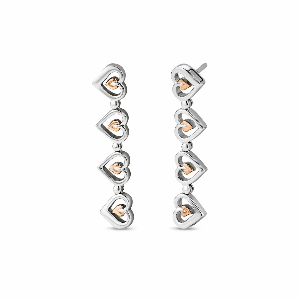 Silver and rose gold heart dangle earrings.
