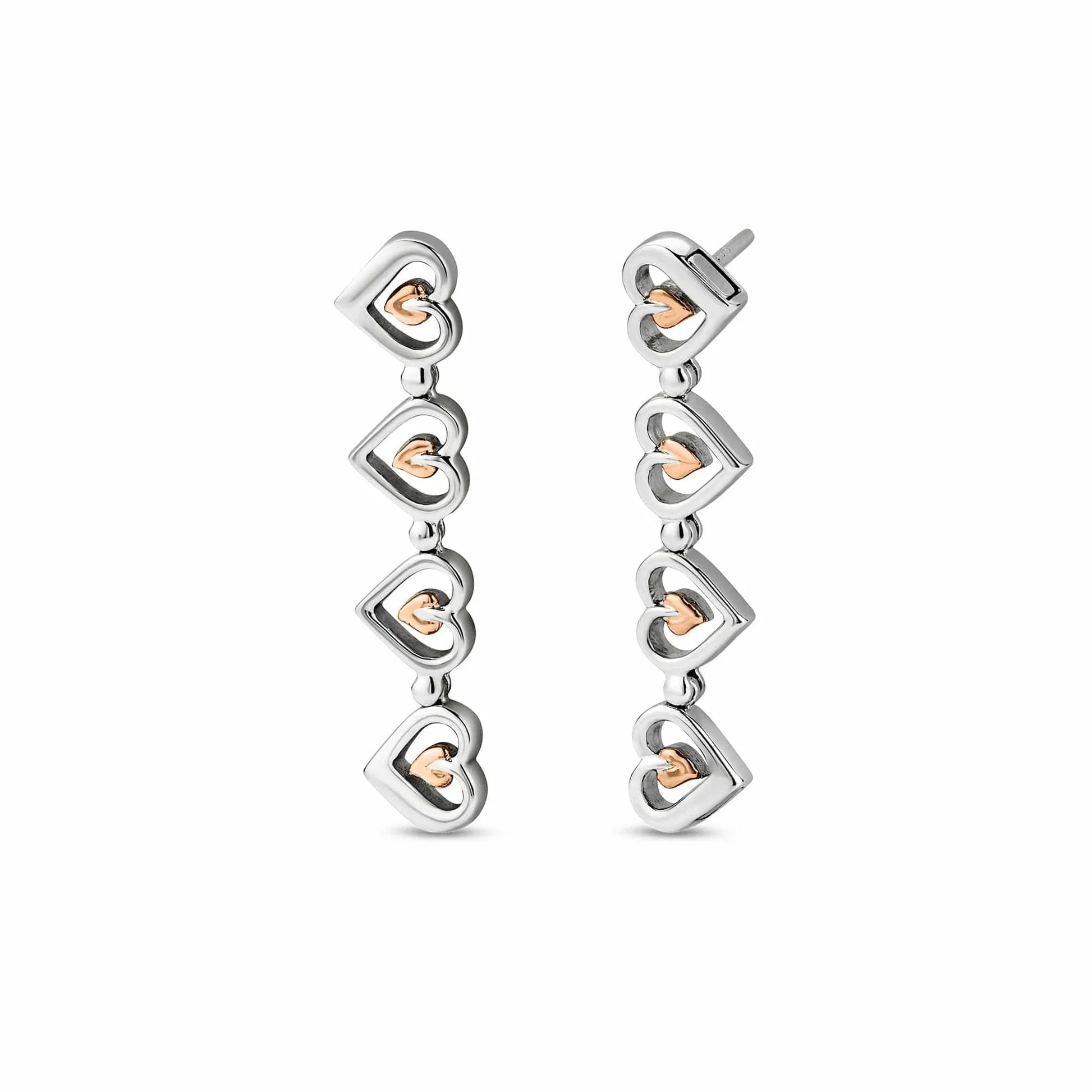Silver and rose gold heart dangle earrings.

